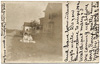 15. Two girls sitting in yard, Main St. and Greenfield Ave.